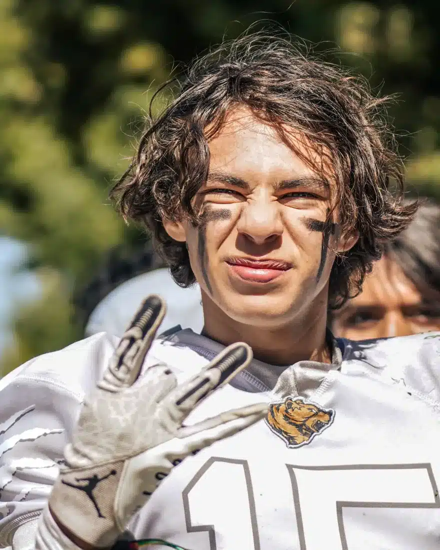 High school football player in a white uniform